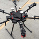 This undated photo provided by the US Customs and Border Protection shows a 2-foot-high drone that a border patrol agent spotted swooping over the border fence on August 8, 2017 near a San Diego border crossing (via AP)